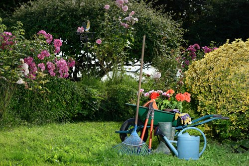 Team preparing lawn mowing equipment at Turnham Green